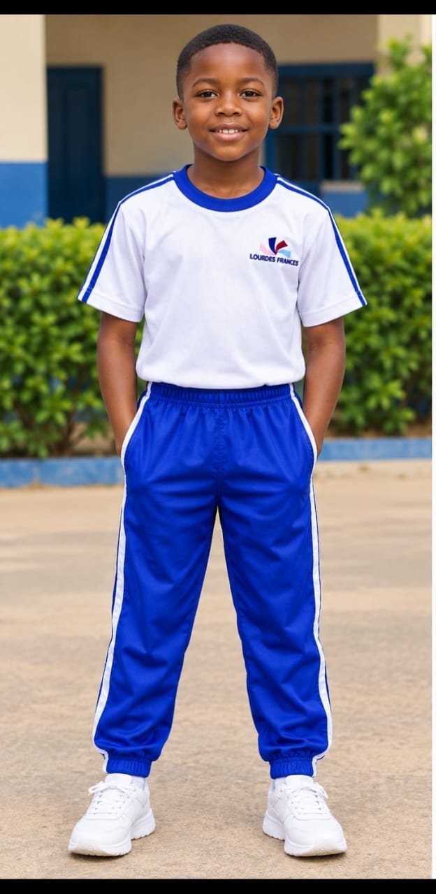 Student wearing a white and royal-blue school sports shirt with matching joggers