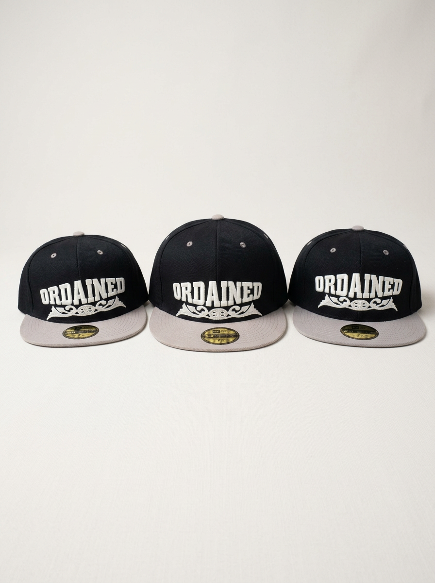 Three black caps with grey brims and white embroidered lettering